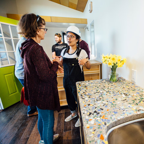 Student presenting a tiny house prototype to help abate homelessness