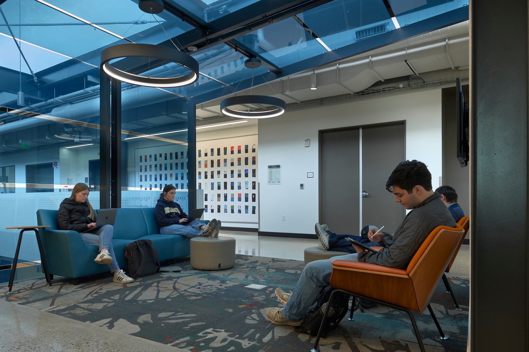 Students studying in the common areas in Norm Asbjornson Hall