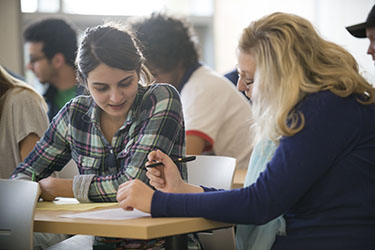 BBCC coach works with a student in Jabs Hall