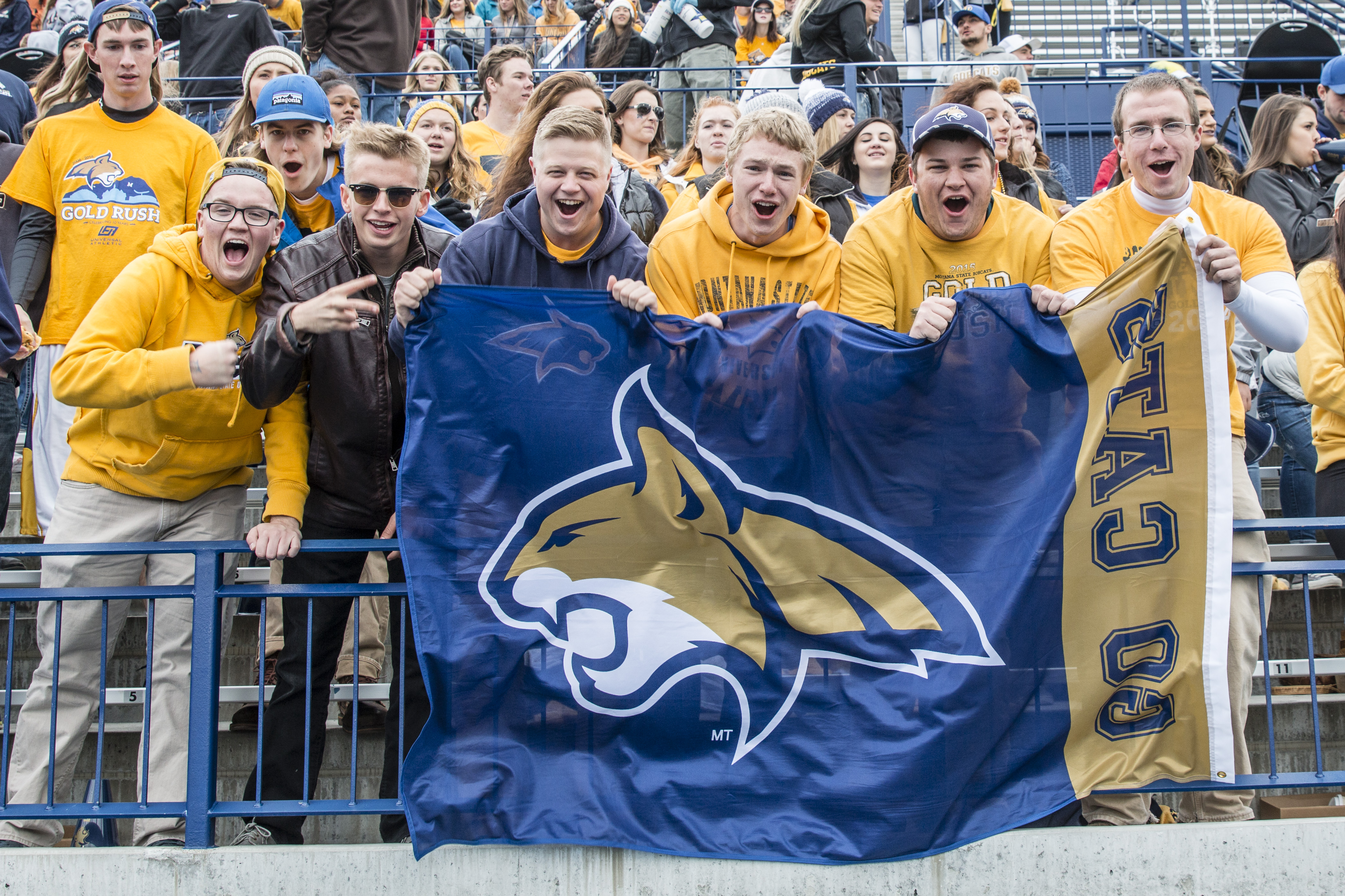 students cheering at football game