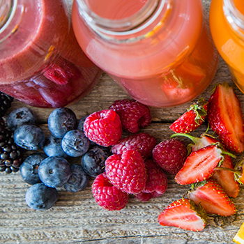 blueberries, rasperries, and strawberries with fruit smoothies