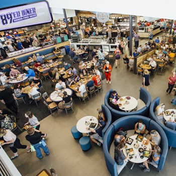 interior photo of rendezvous dining pavilion with hundreds of people sitting at tables eating