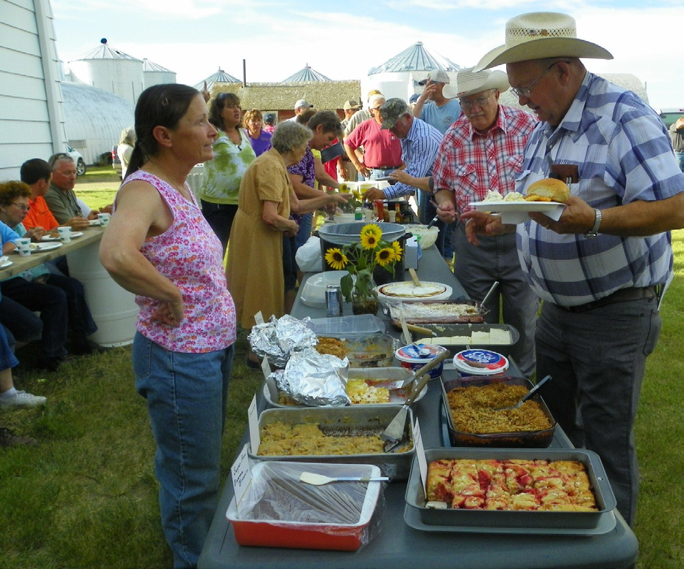 Group of people at a potluck.