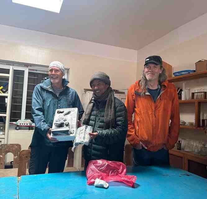 A photo of the donated microscope and picture of the fundraiser.