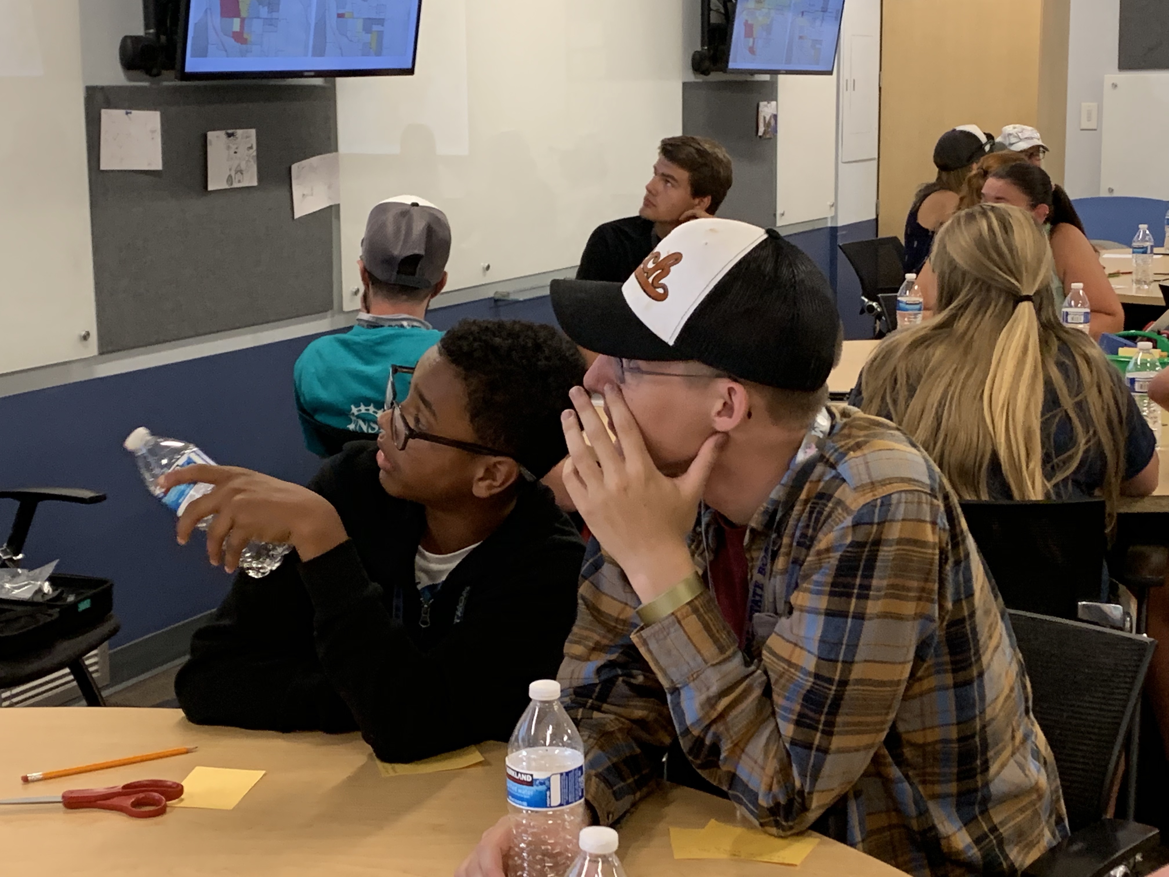 students listening to instructor