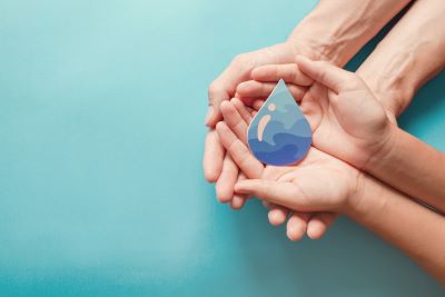 hands with water drop image