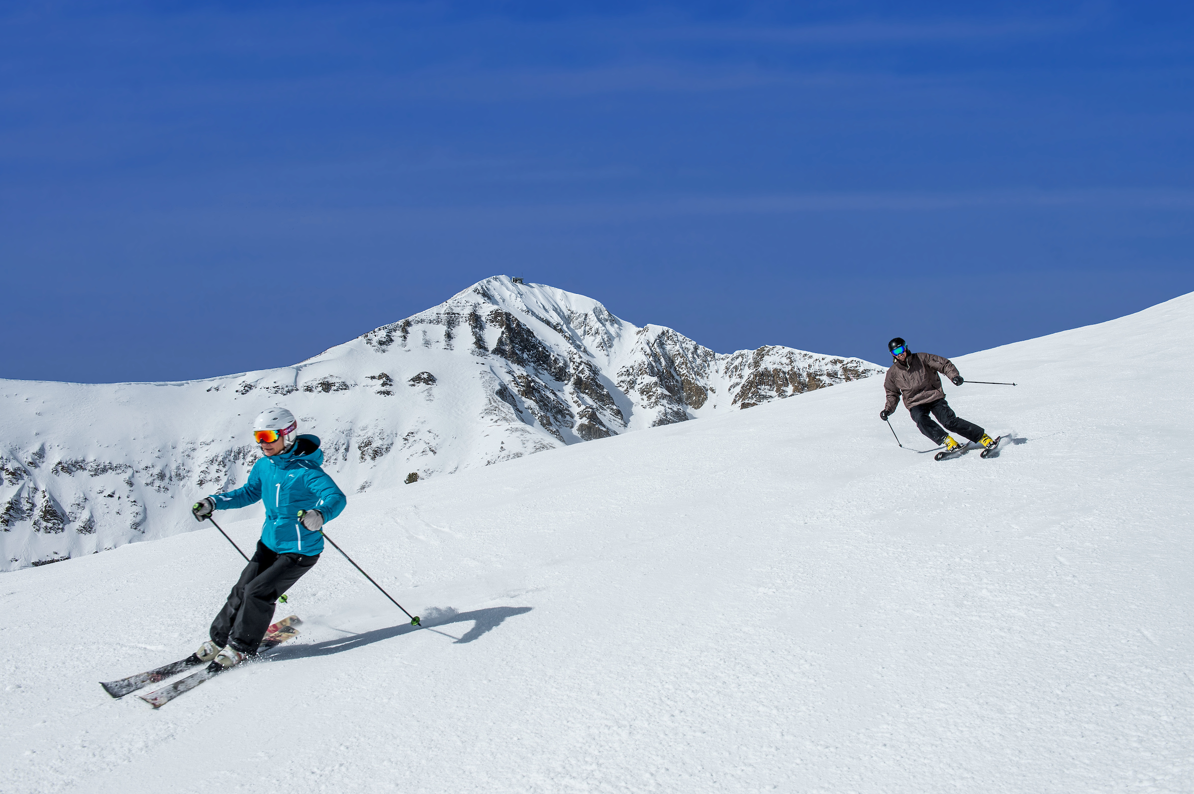 Two people skiing