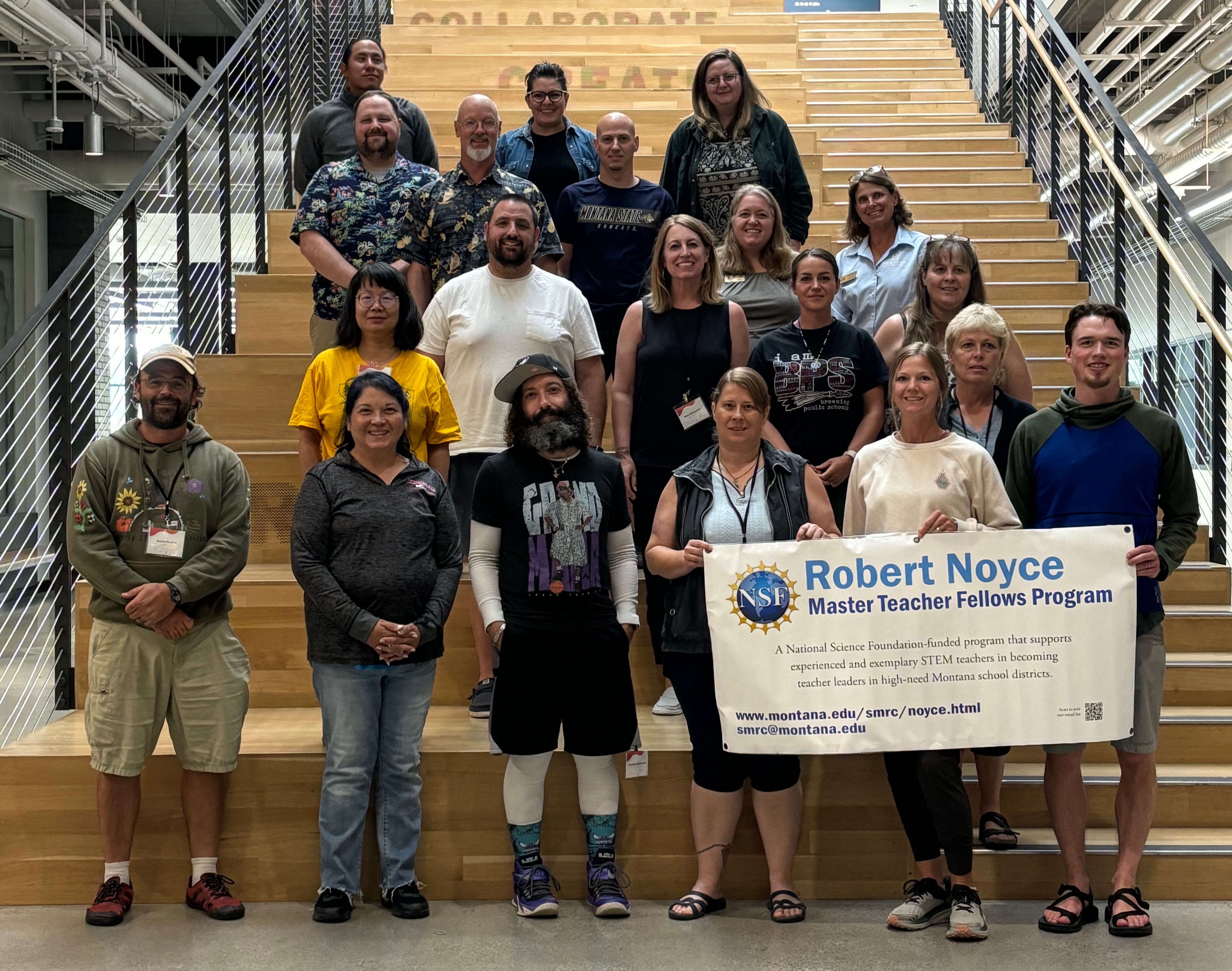 group of people with ROBERT NOYCE sign