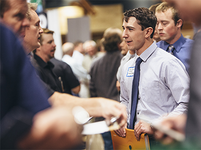 Student speaking to a recruiter at a career fair